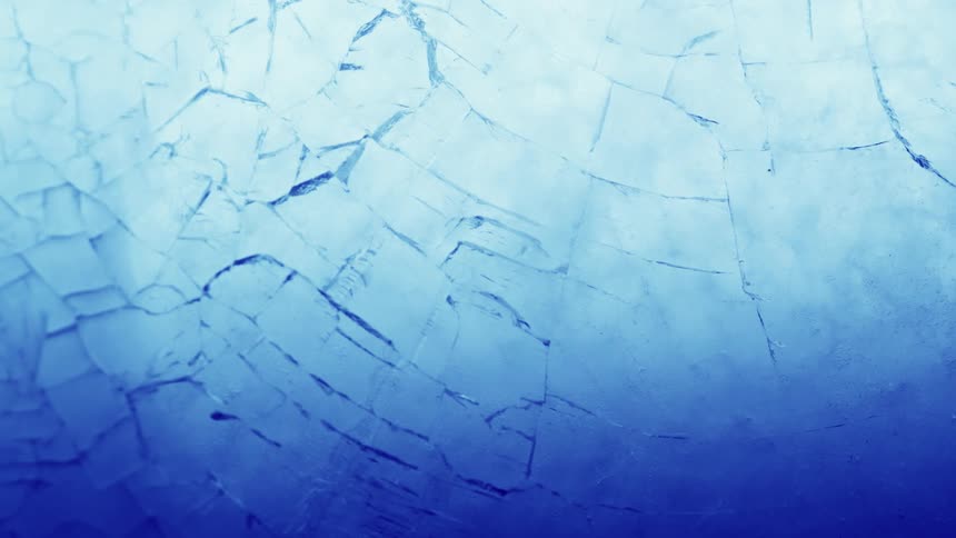 White blue and gray colors that look like ice freezing and cracking