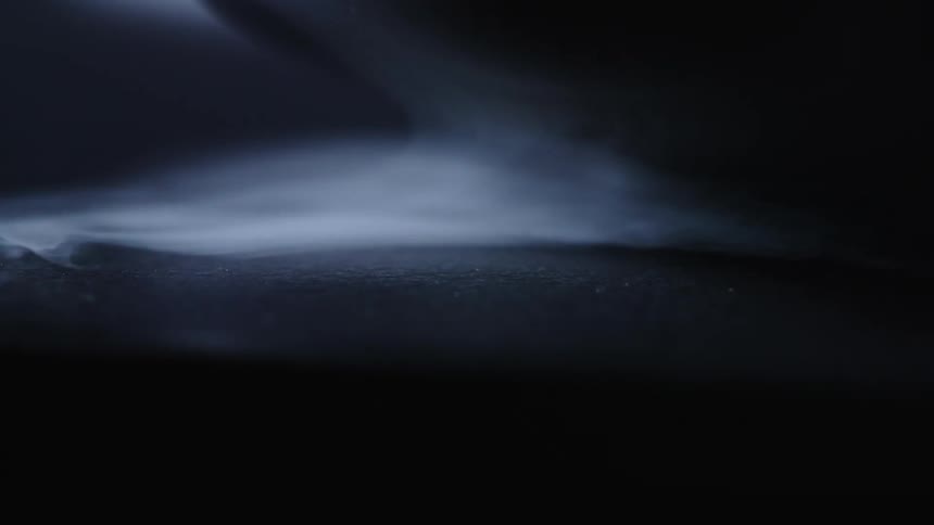 The smoke moves in the dark