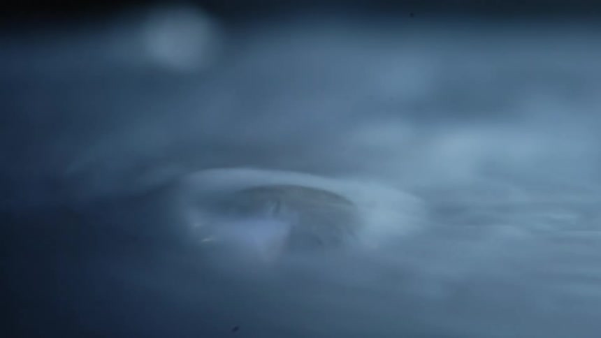 White smoke flowing from a water bubble inside a room
