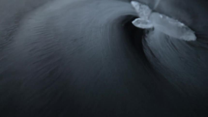 A piece of ice that is melting in water