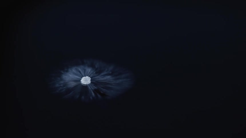 White smoke floating and swirling around dry ice floating in water