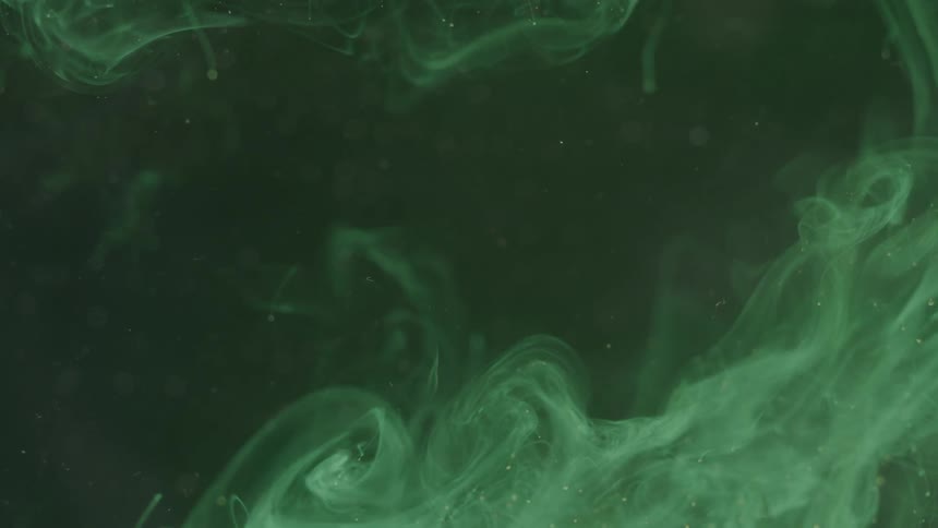 A substance swirls suspended in liquid