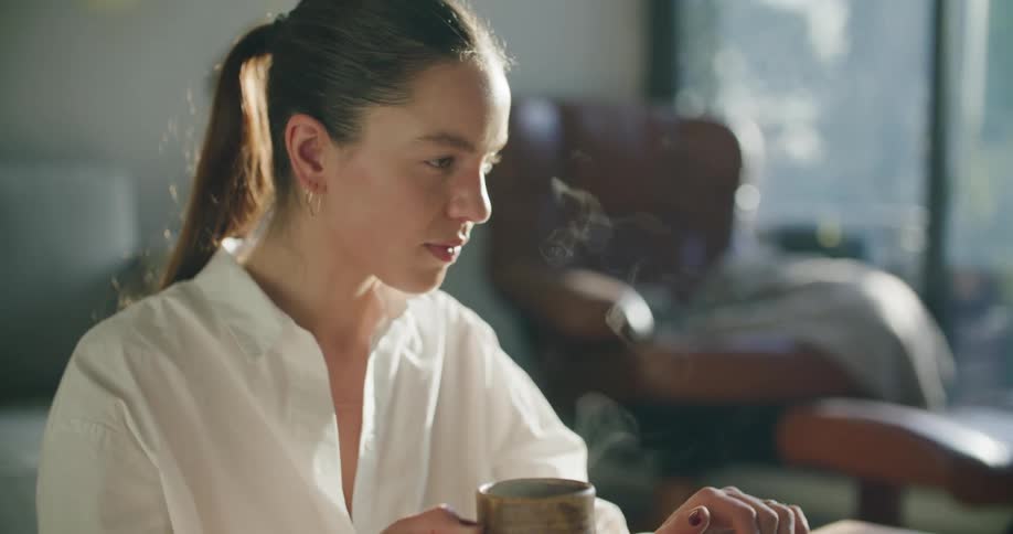 A woman that is on a laptop talking to someone