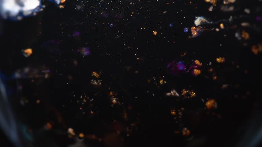 Blue black and gold colors that look like glitter and water