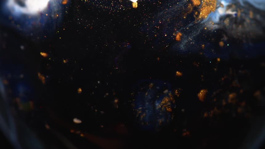 Blue black and gold colors that look like glitter and water