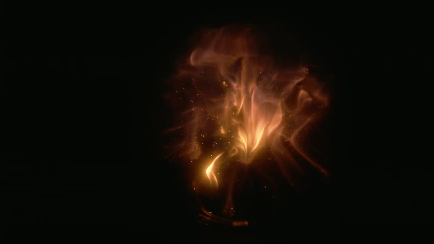 Flames shoot out of a tube and are contained in a clear globe in the darkness