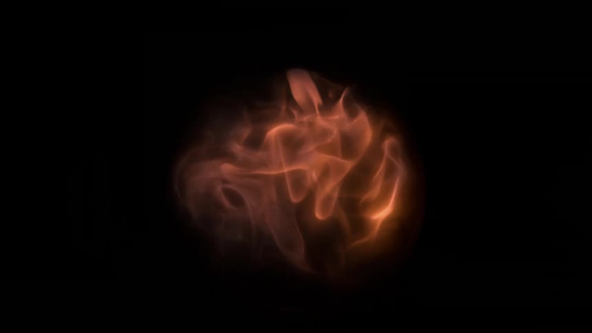 Orange flames dissipating inside a glass ball on a black background