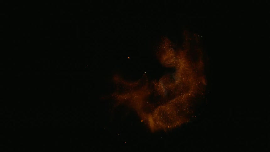 Black orange and yellow colors that look like fireworks in the night sky