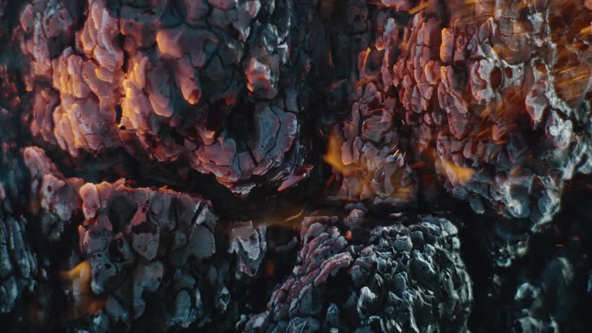 Embers and ash from a bonfire away in the wind