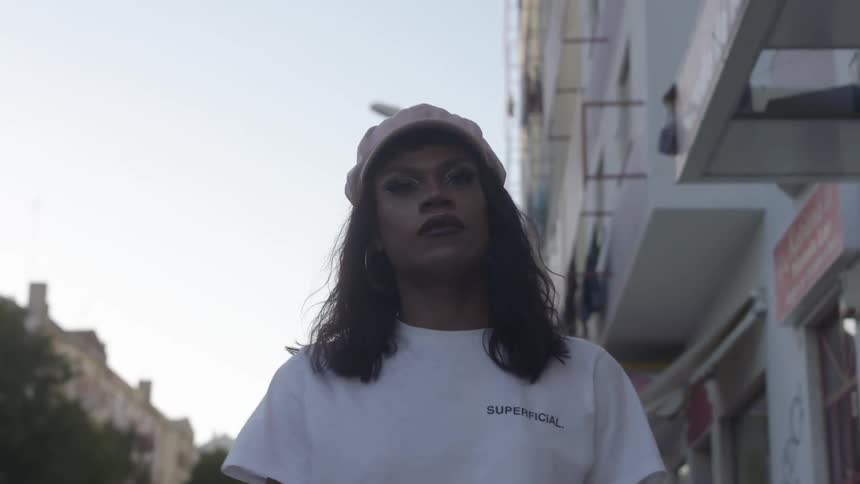A woman is walking in a downtown city