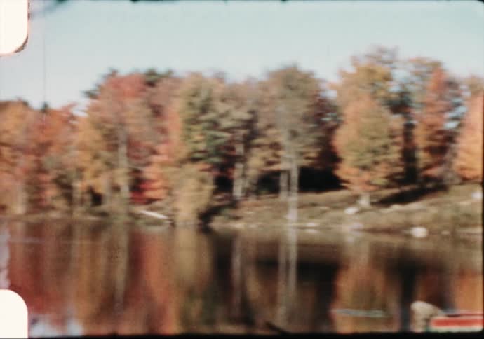 Water with autumn trees around