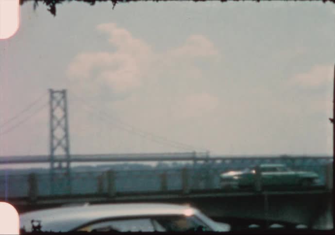 Vehicles travel over the long bridge