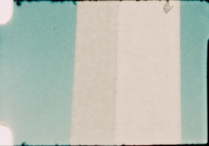 American flags waving in the wind at the base of the washington monument caught on film