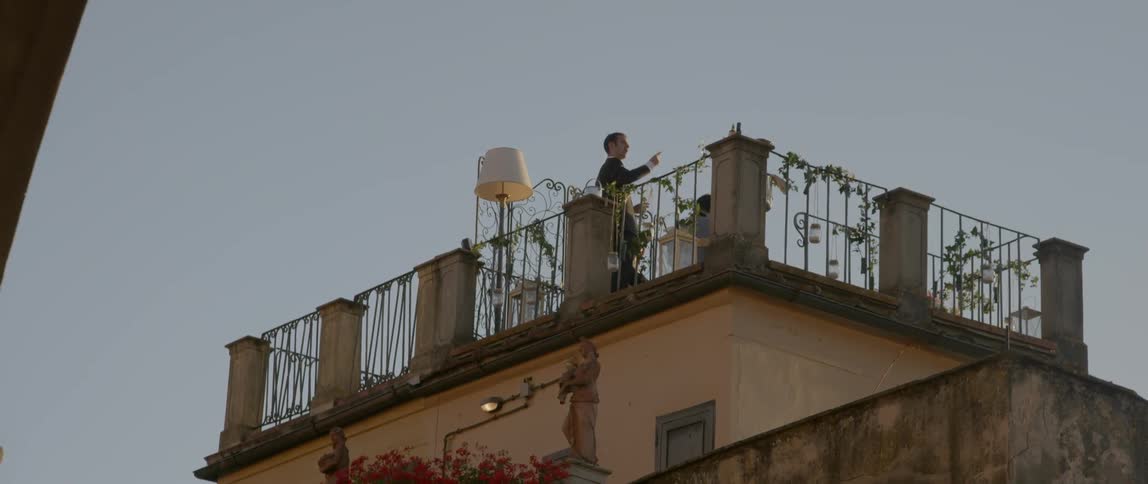 People standing on a trellised rooftop