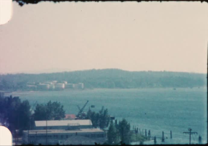 A view of a lake with hills behind it