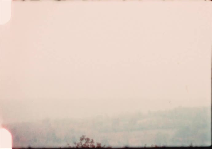 Footage of a wide landscape is caught on video camera