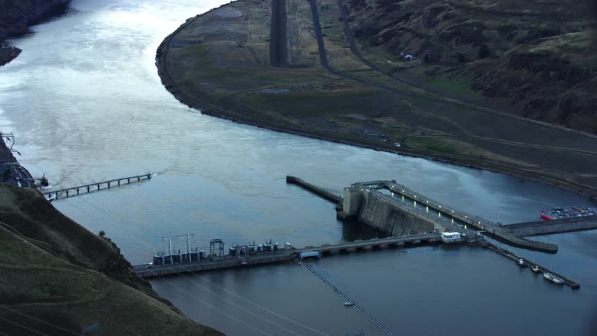 A sweeping aerial shot of Granite dam on the Lower Snake River in Idaho revealing the extend of the impoundment and it's impacts on the once free flowing river and salmon migration