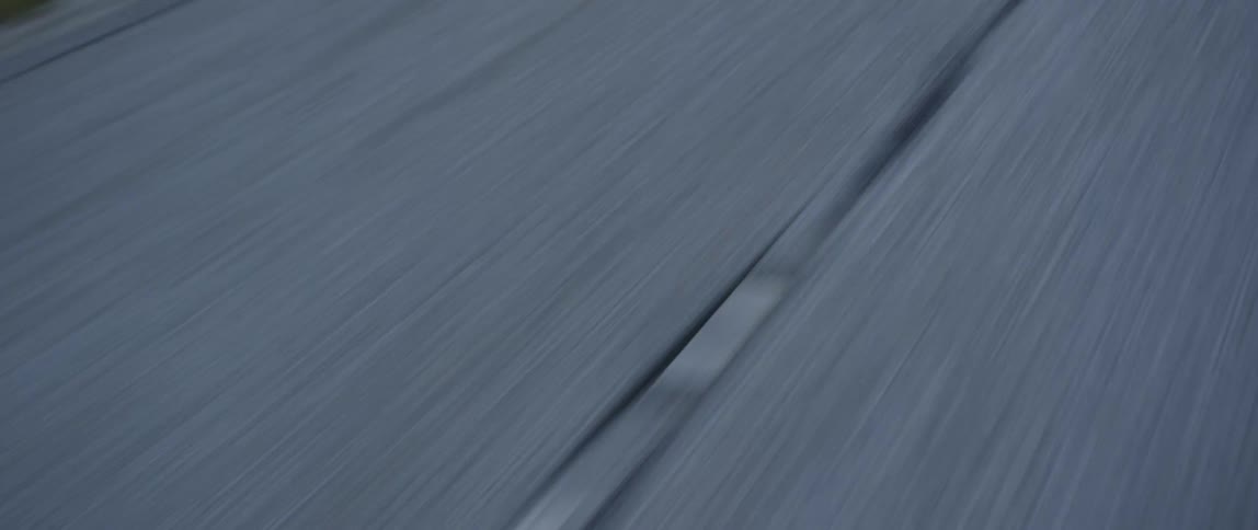 White lines in the middle of a rural road at daytime