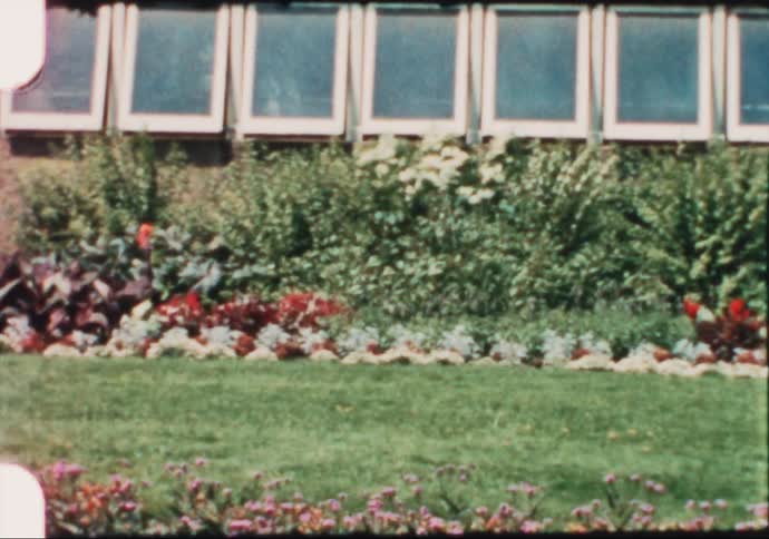 Vintage film of the gardens outside a toruist attraction