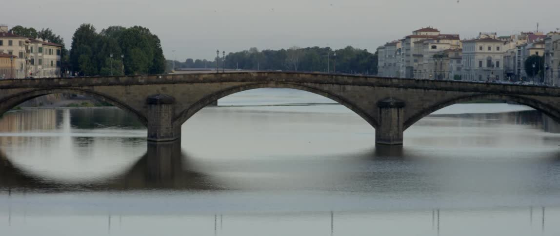 A bridge sits low to the water