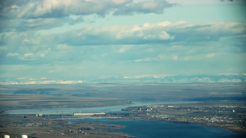 McNary Locke and Dam spans the Columbia River with I-82 in the foreground showing the vast plain of the Lower Columbia River valley