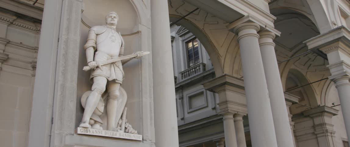 Statue in a support column of a building
