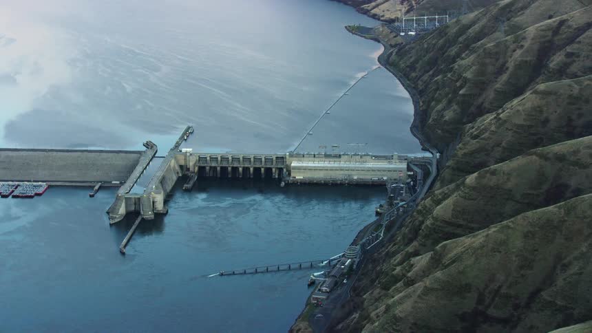 Looking down at Lower Granite Dam on the Snake River near Lewiston and Clarkston showing the impoundment and the river at sunset