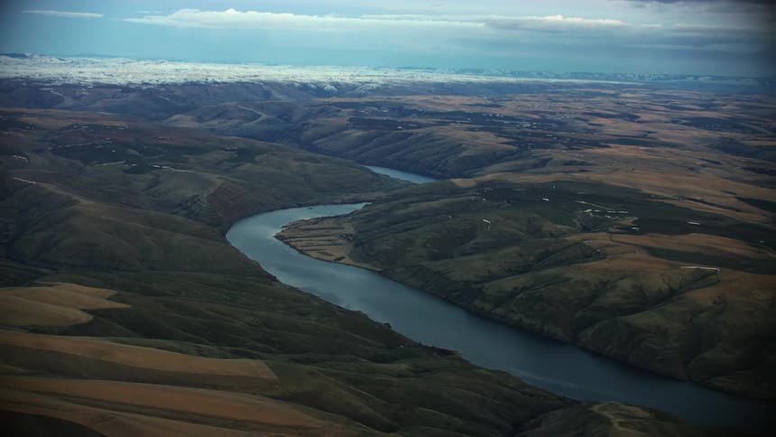 Blue hour aerial shot of the Lower Snake River meandering through the high Palouse country of eastern Washington as the sun sets in winter