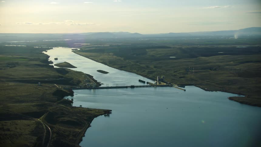 Ice Harbor Dam on the Lower Snake River in Eastern Washington near the confluence of the Columbia River with farmland and agricultural land on both sides of the river