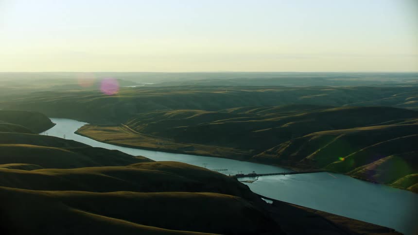 Super Wide shot of Little Goose Dam that Impounds the Snake River on the Lower Snake River in beautiful sunset light