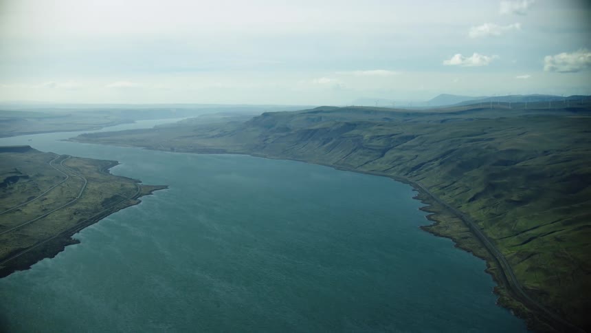 Vast wide sweeping aerial shot of the Columbia River in Eastern Oregon and Washington as it flows towards the Pacific Ocean