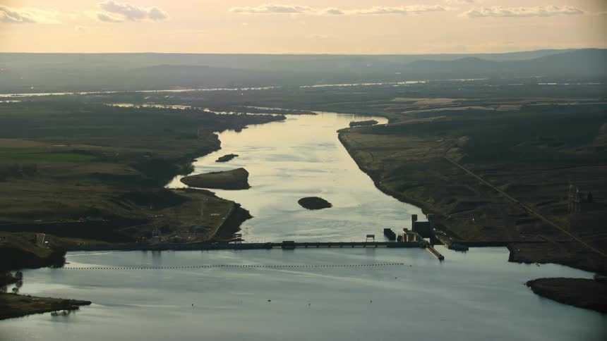 Ice Harbor Dam on the Lower Snake River with the Columbia River in the background in the this evening sunset aerial showing the height and impact of the impoundment on the river
