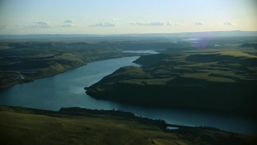 The Lower Snake River as seen from high above in this sweeping aerial shot in warm afternoon light over the Palouse hills in Eastern Washington