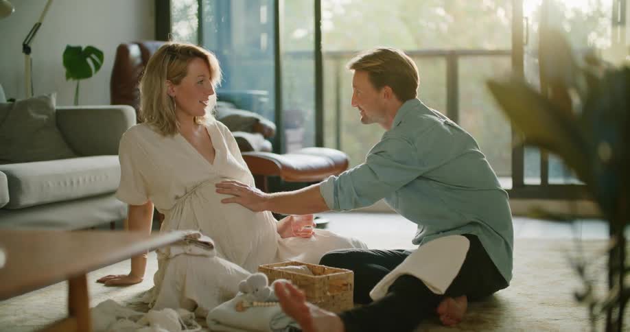 Pregnant woman and husband talking
