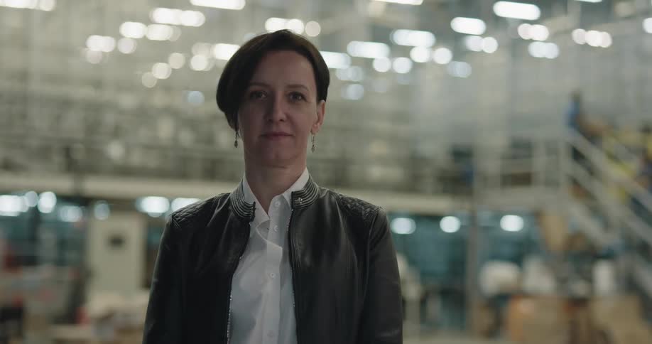 A woman is standing in a building