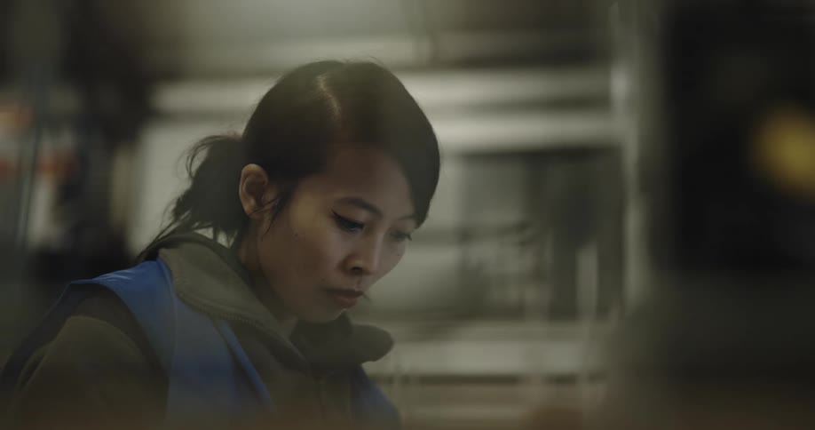 Woman wroking in the office on a warehouse in front of a computer