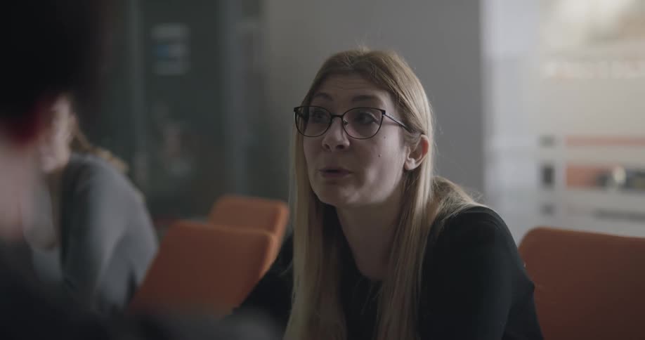 Woman talking to coworkers on a meeting at the office