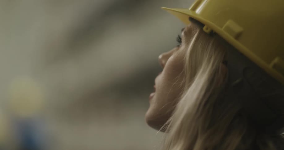 A worker talks on the walkie talkie