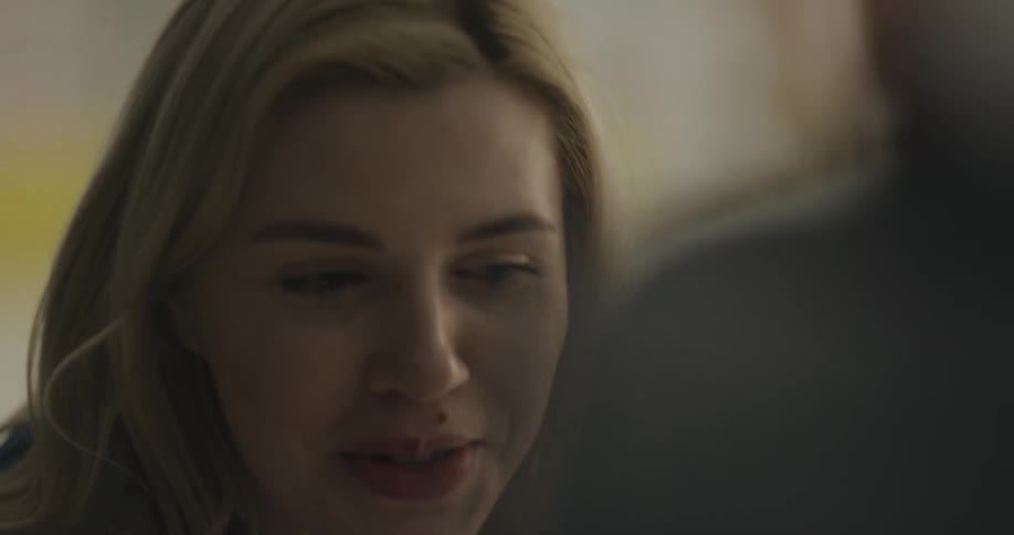 A view of a woman that is talking to someone else