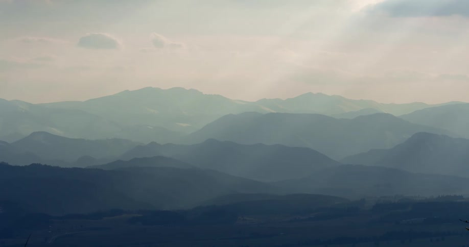 Faint hills fade into the distance on a sunny day