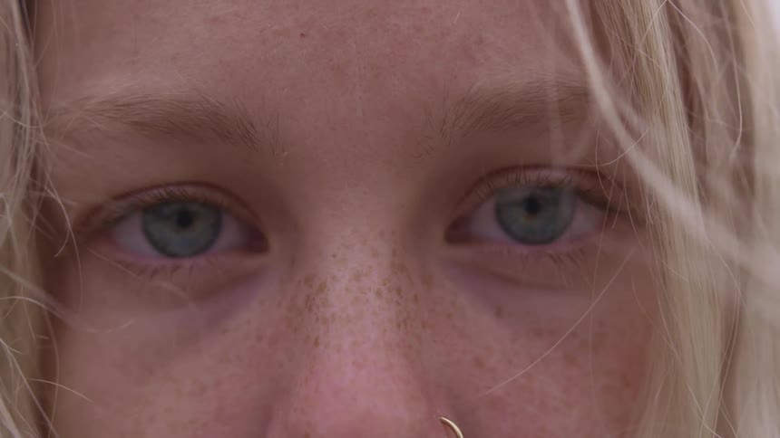 A girl with a nose ring staring