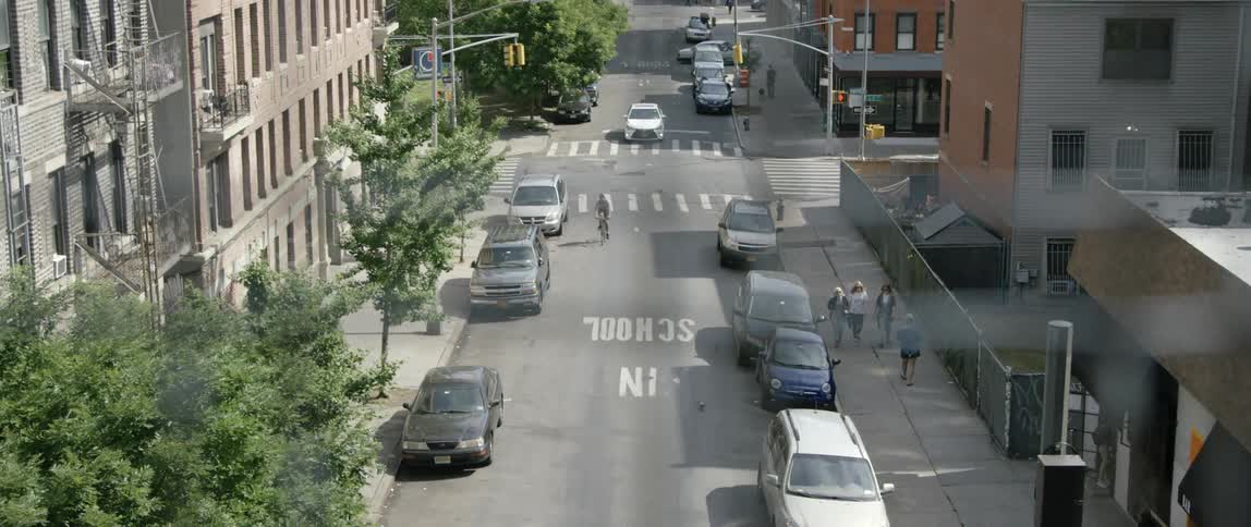 A bicyclist and pedestrians on an urban street