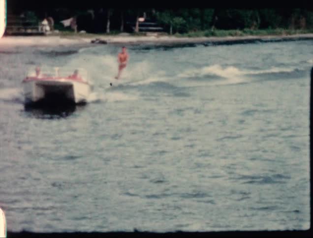 A person water skiing behind a boat