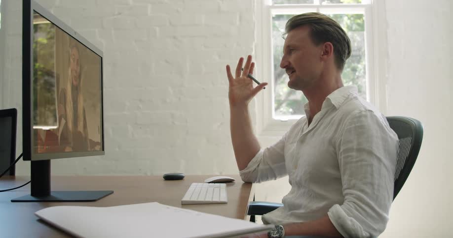 Man video calls with woman before waving and blowing a kiss