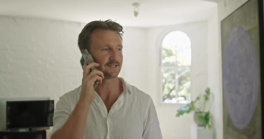 A man is talking on his cell phone