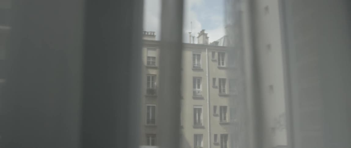 An apartment building on a cloudy day