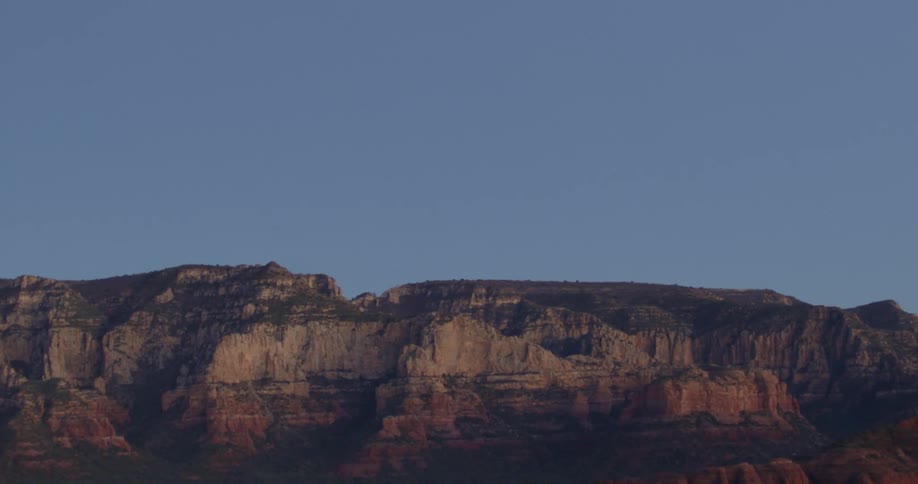 Cliffs and mountains are in the horizon