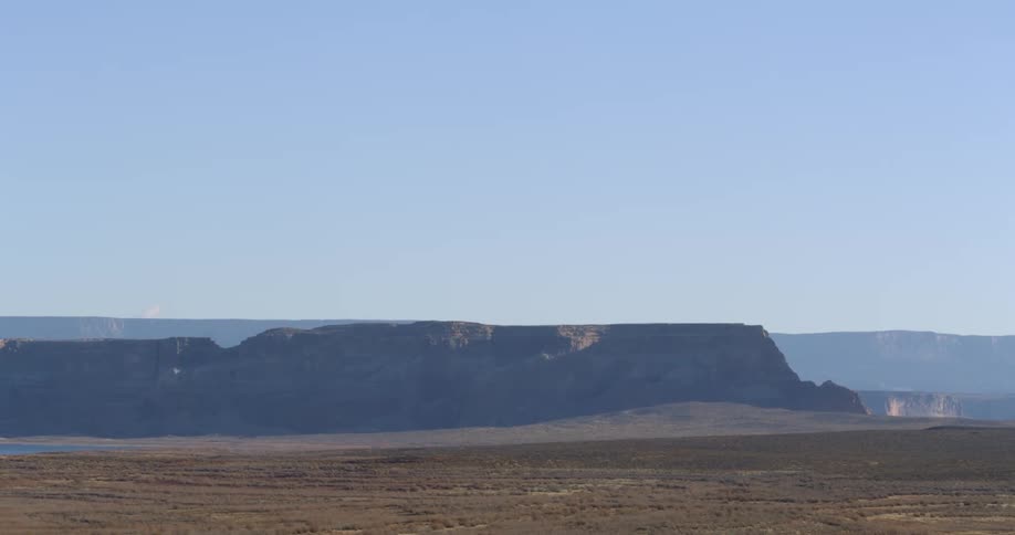 A mesa in a desert during the day