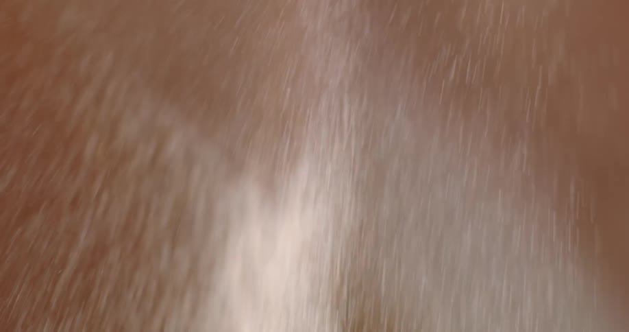 Abstract sparks or water fly through the air