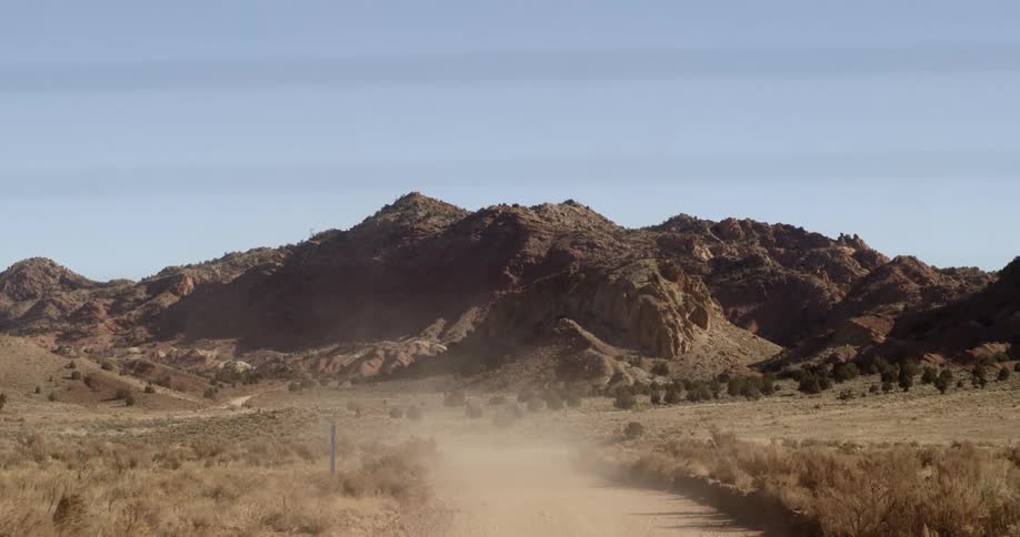 A scenery of a road in the desert